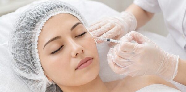 Woman with glowing skin for skin booster treatment by age at Luna Clinic KL